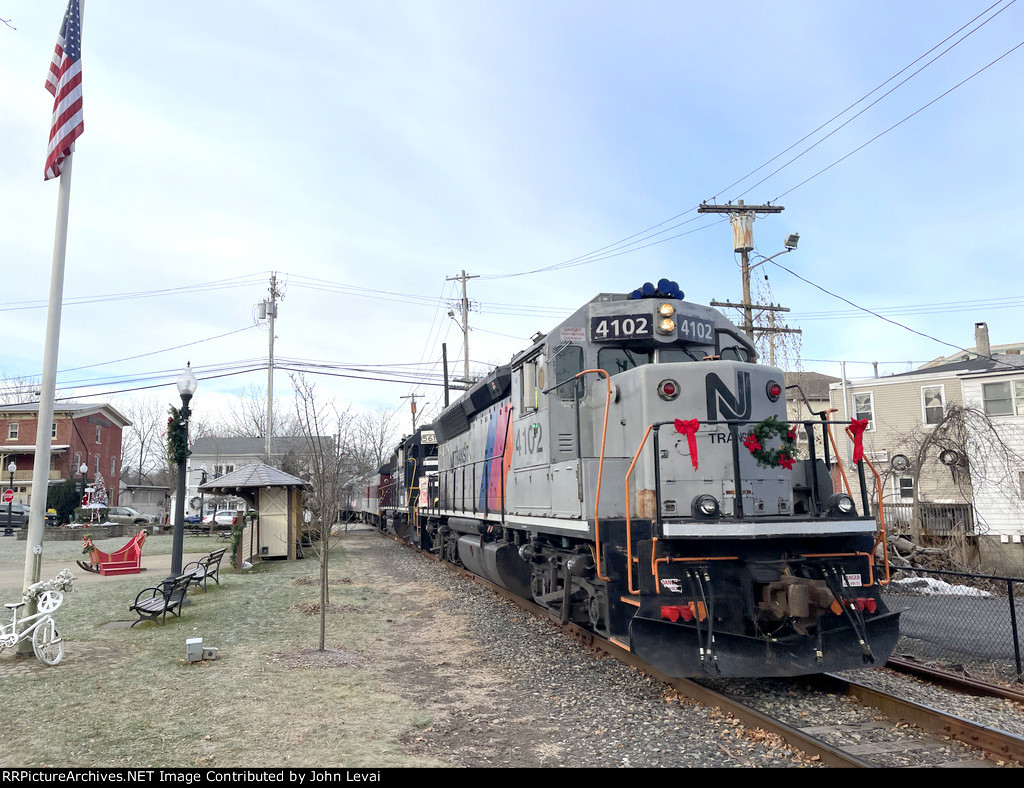 NJT 4102 and M&NJ # 5615 push part of the consist across Main Street in Warwick to be connected to the rest of the train before proceeding north to the first collection stop, located just north of the South St Grade Crossing